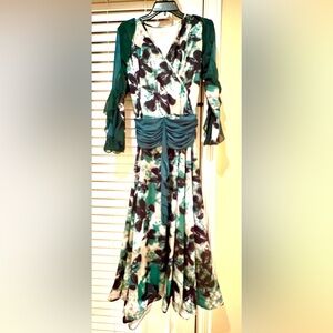Brand new maxi floral dress. Chiff details on sleeves. Full skirt.
